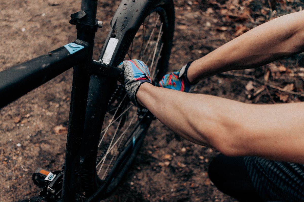 A bicycle wheel being repaired
